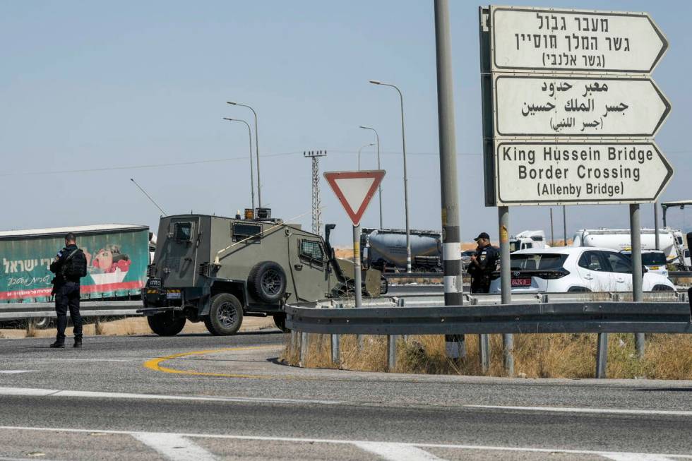 Israeli police stand guard near the site of a deadly shooting attack where Israeli officials sa ...