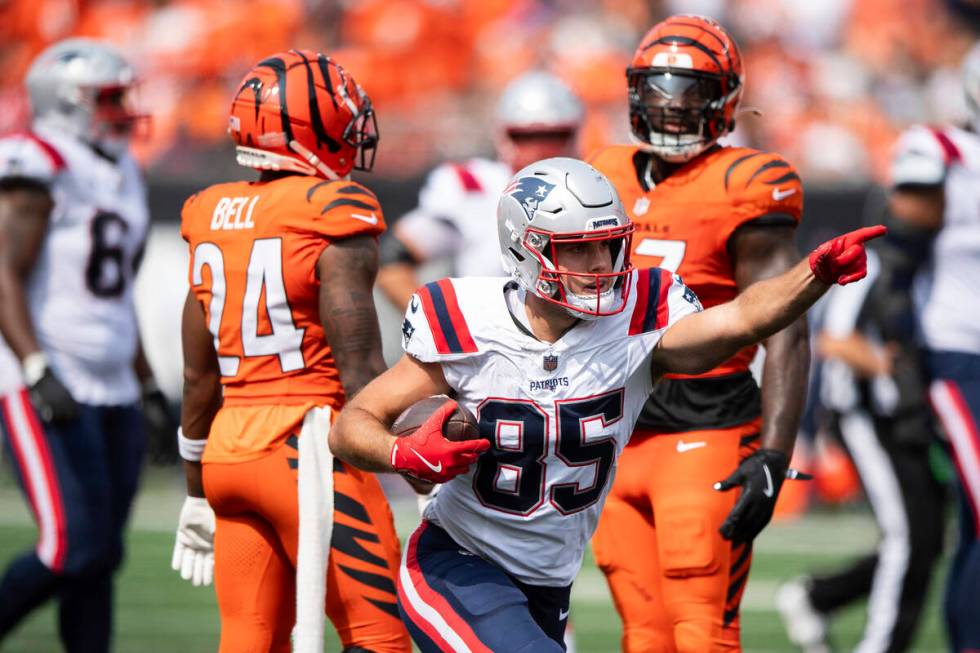 New England Patriots tight end Hunter Henry (85) celebrates after carrying the ball in the seco ...