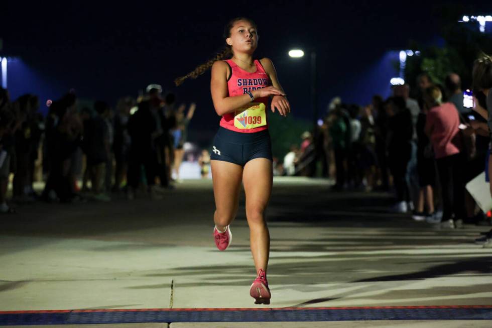 Shadow Ridge’s Elynn Okuda crosses the finish line during the Red Rock Running Company I ...