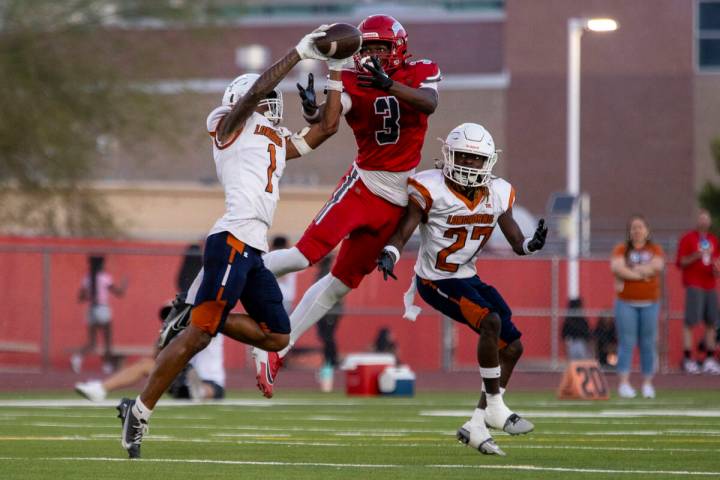 Arbor View wide receiver Damani Warren (3) is picked off by Legacy senior Dominic Oliver (1) du ...