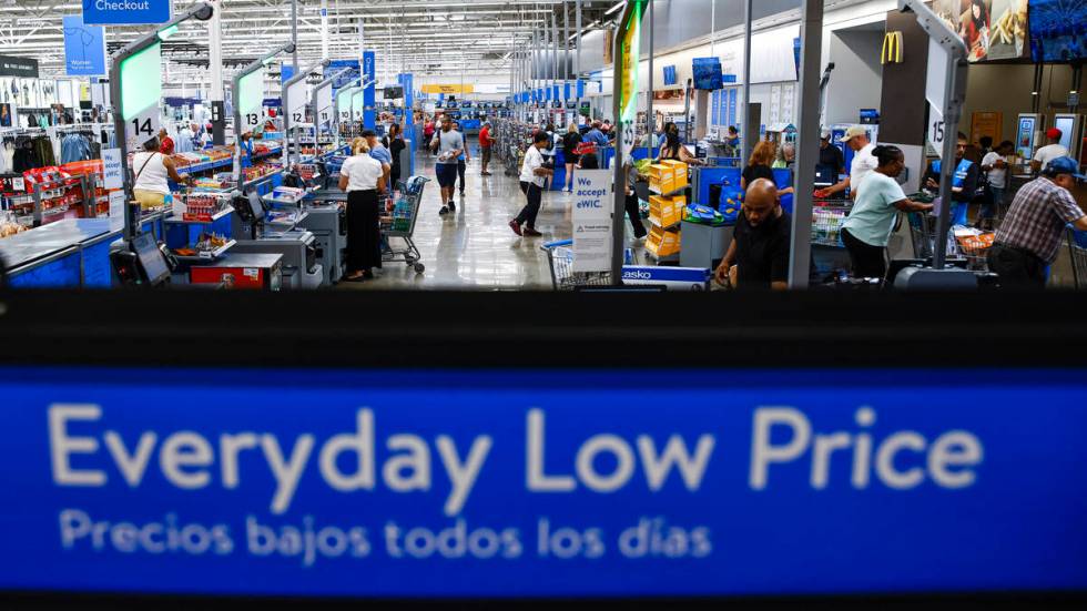 Customers use self check out at a Walmart Superstore in Secaucus, New Jersey, July 11, 2024. (A ...