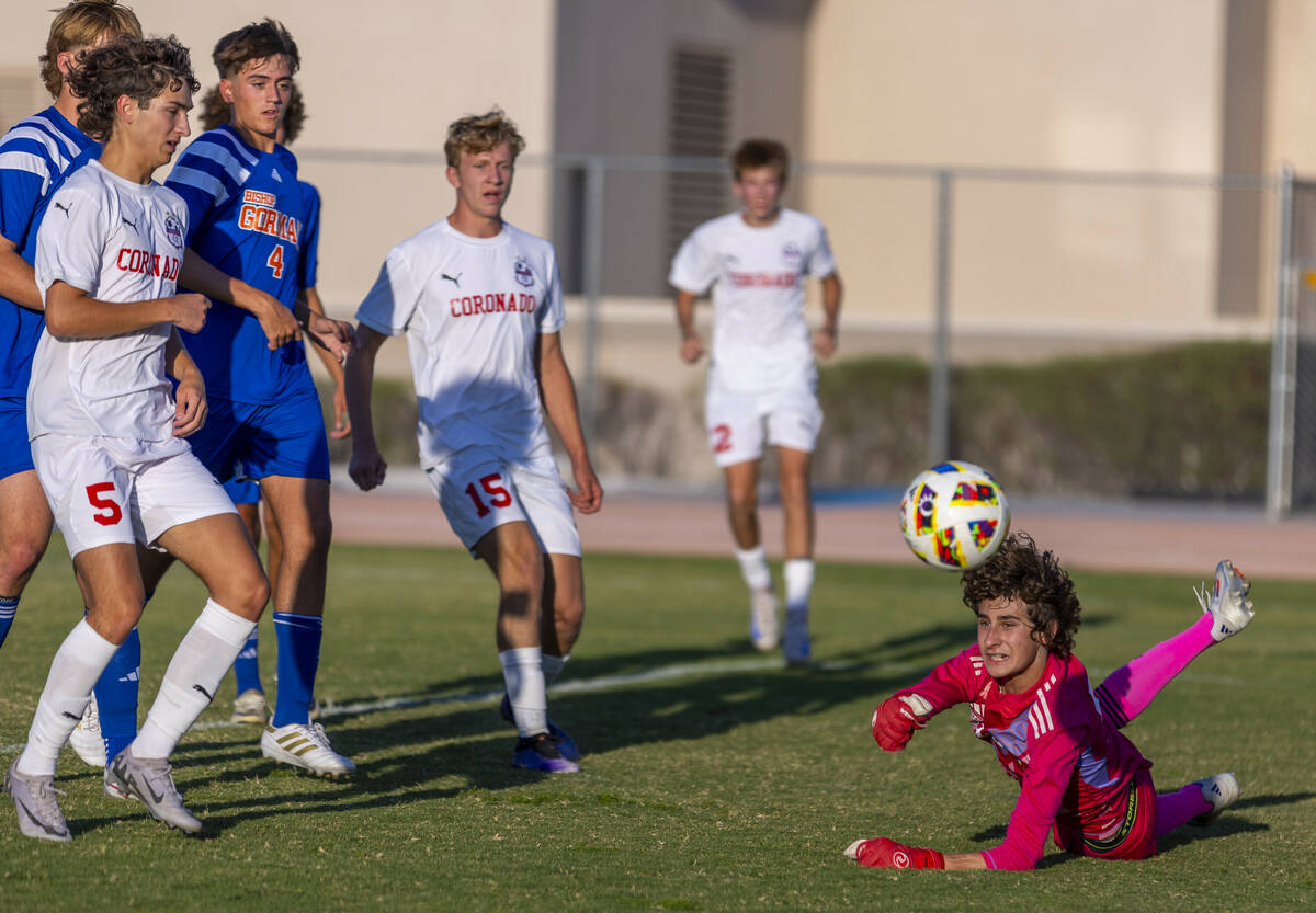 Bishop Gorman goalkeeper Chase Cosenza (99) deflects away a shot by Coronado during the first h ...