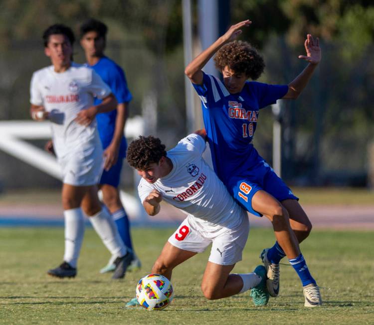 Bishop Gorma Coronado striker Dylan Flores (9) steals the ball from Bishop Gorman defender Eli ...