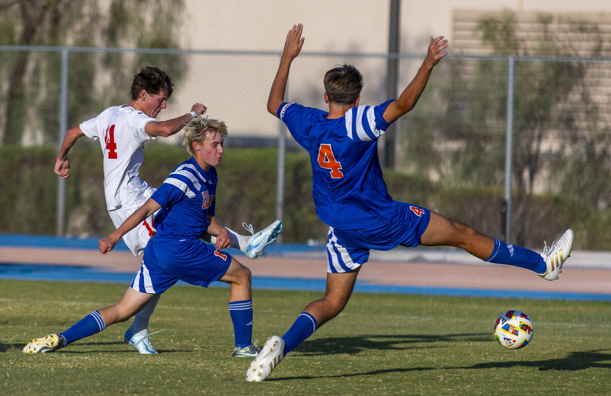 Coronado midfielder Gavin Biddinger (14) takes a shot on goal past Bishop Gorman defender Massi ...