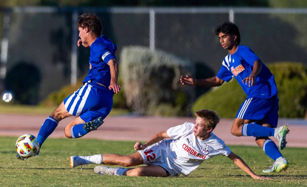 Coronado midfielder Liam Bringhurst (12) misses a tackle on Bishop Gorman midfielder Maddix Bor ...