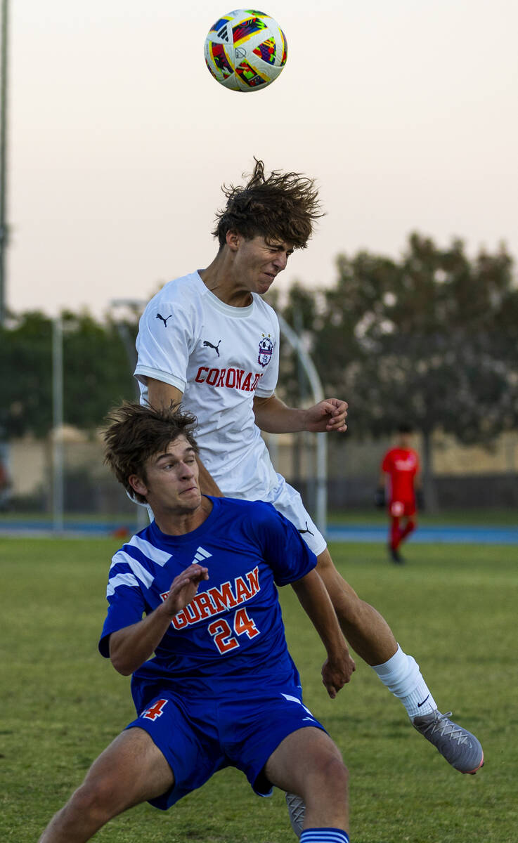 Coronado defender Grayson Elisaldez (3) heads the ball over Bishop Gorman forward Alexander Rog ...