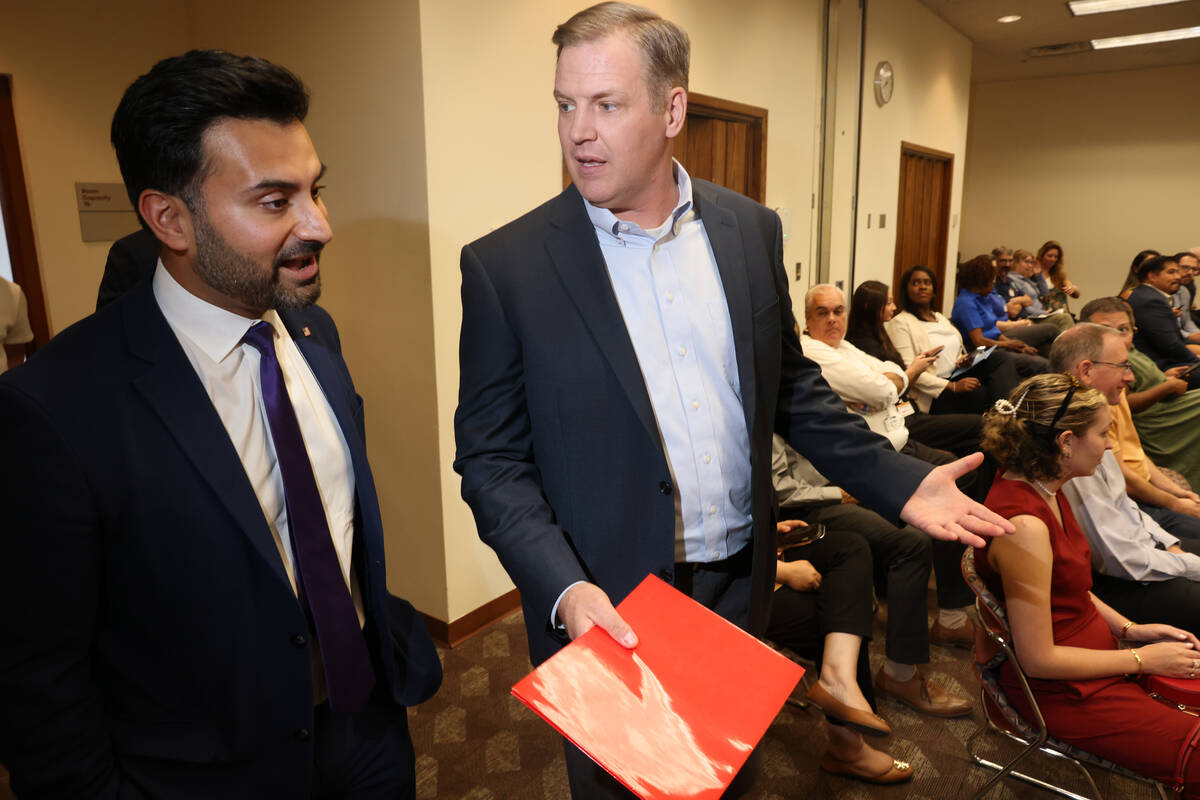 White House National Climate Adviser Ali Zaidi, left, and NV Energy President and CEO Doug Cann ...