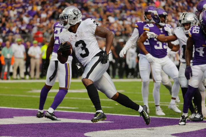 Las Vegas Raiders running back Zamir White (3) runs against the Minnesota Vikings during the fi ...