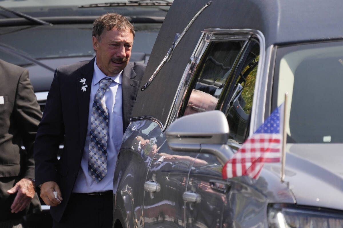 Guy Gaudreau looks into a hearse containing the remains of his son Columbus Blue Jackets hockey ...