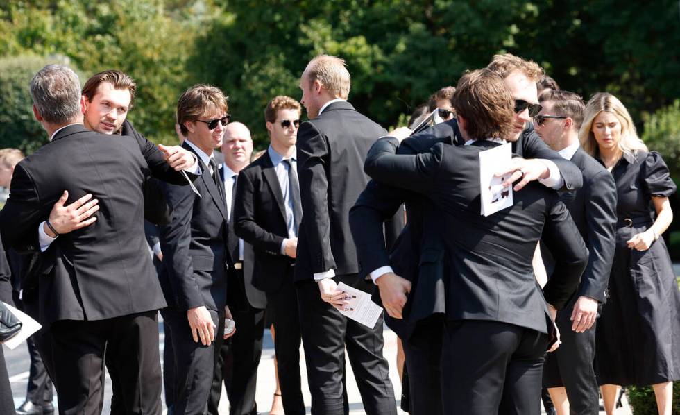 Players from the Columbus Blue Jackets and hockey players embrace after funeral for Columbus Bl ...