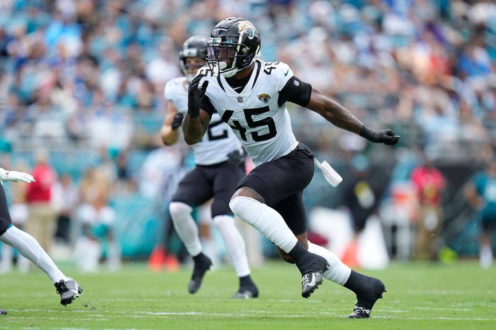 Jacksonville Jaguars linebacker K'Lavon Chaisson (45) rushes toward the ball during an NFL foot ...