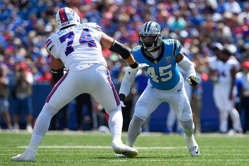 Carolina Panthers linebacker K'Lavon Chaisson (45) is blocked by Buffalo Bills tackle Ryan Van ...