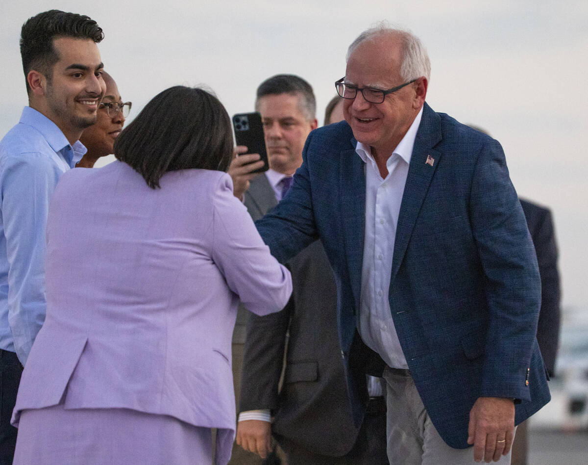 Democratic vice presidential candidate Minnesota Gov. Tim Walz, right, greets Assemblywoman Eri ...