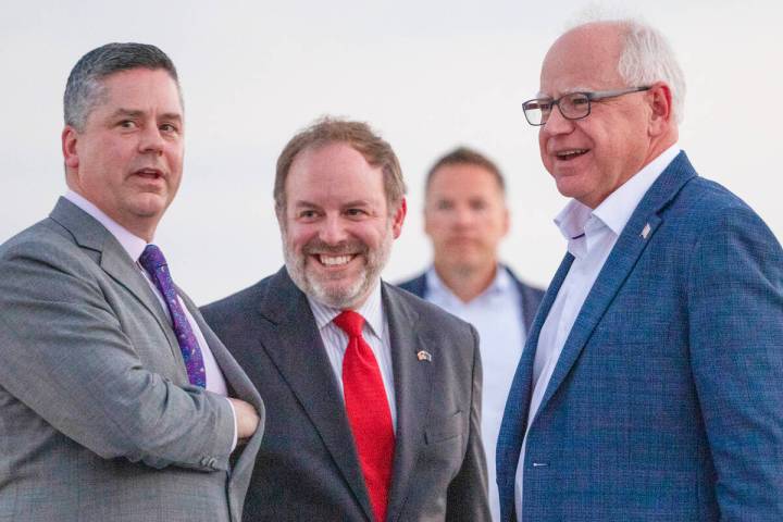 Democratic vice presidential candidate Minnesota Gov. Tim Walz, right, greets Nevada State Trea ...