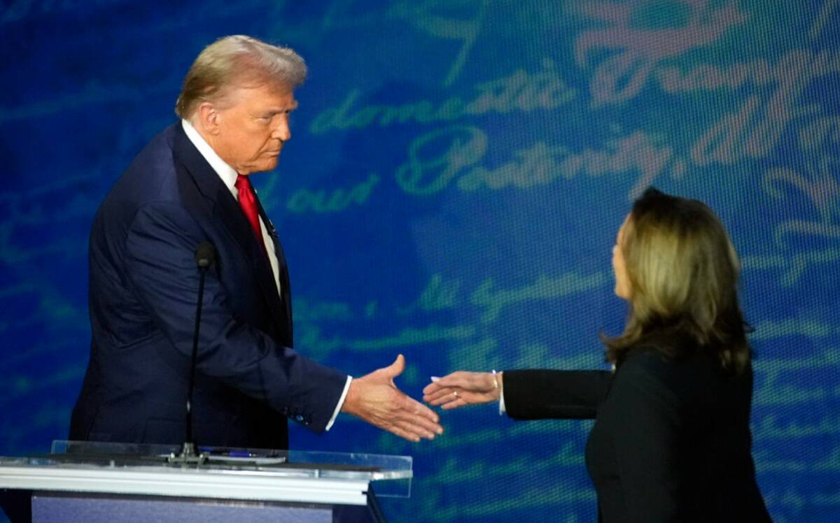 Former President Donald Trump shakes hands with Vice President Kamala Harris during an ABC News ...