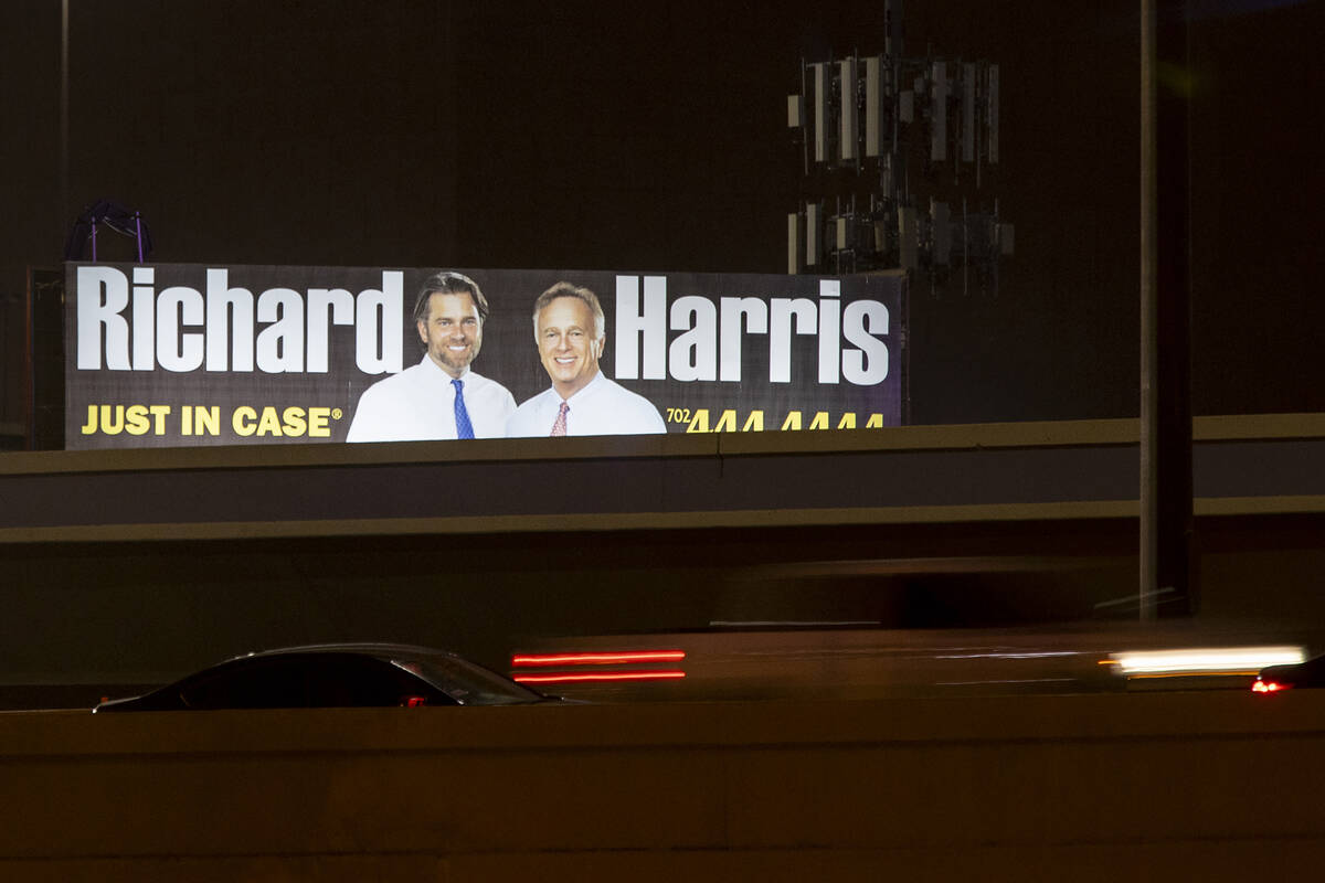 A billboard advertises Richard Harris Personal Injury Law Firm near the freeway, Monday, Aug. 1 ...