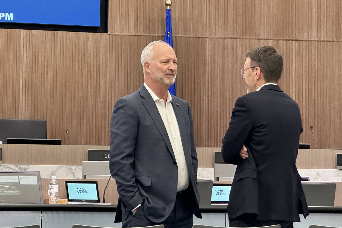 Las Vegas Stadium Authority Chairman Steve Hill, left, chats with Oakland Athletics executive S ...