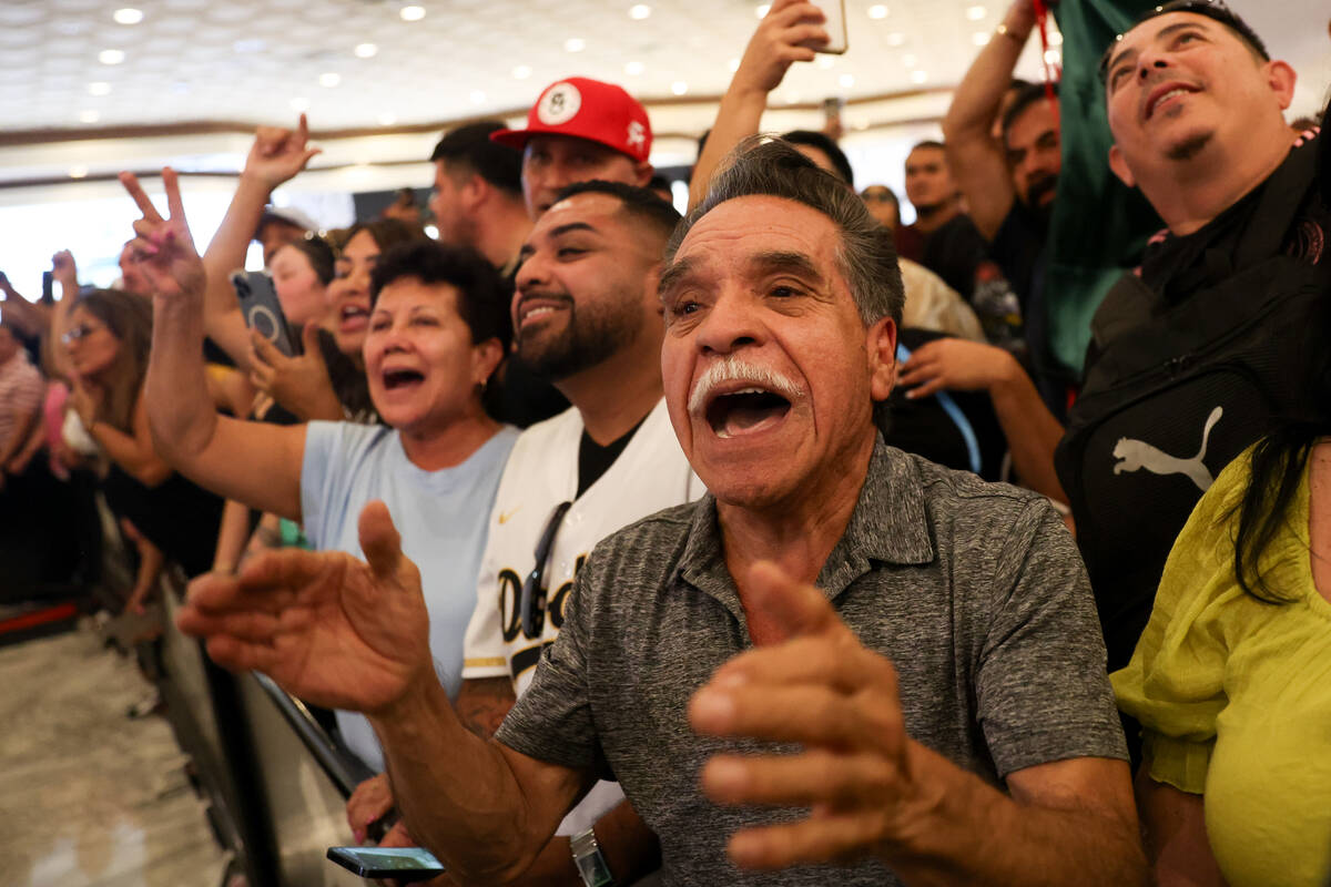 Canelo Alvarez fans cheer for the boxer as he speak to the press ahead of his super middleweigh ...