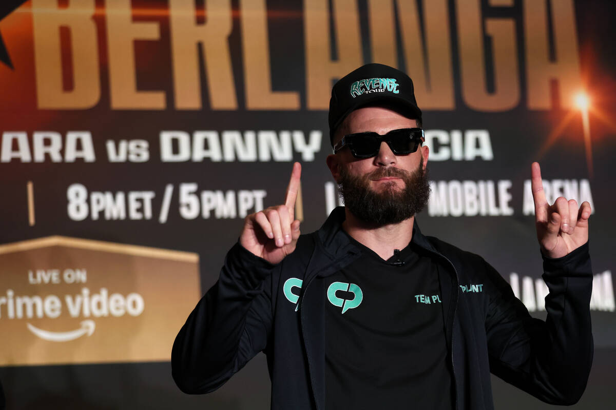 Caleb Plant poses on stage with his daughter ahead of his WBA interim super middleweight title ...