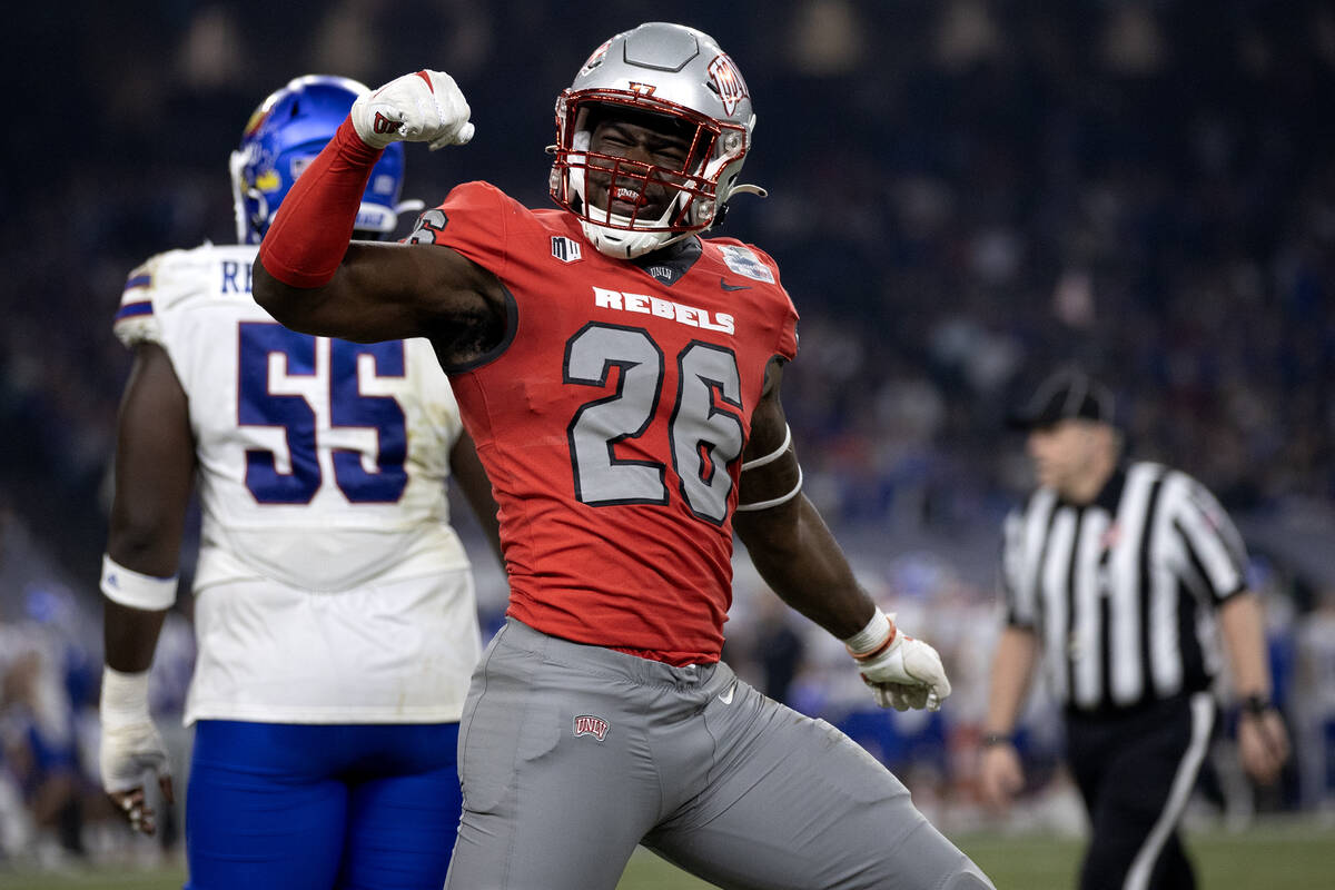 UNLV Rebels defensive lineman Ose Egbase (26) celebrates after breaking up a Kansas Jayhawks pa ...