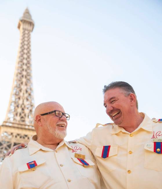 Mike Grenier, left, and James Ealey, right, both Paris Las Vegas day-one employees, laugh outsi ...