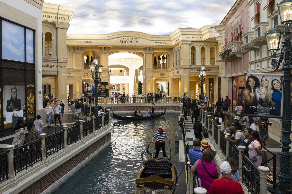 Tourists take a gondola ride in the Grand Canal at the Venetian hotel-casino photographed, on T ...