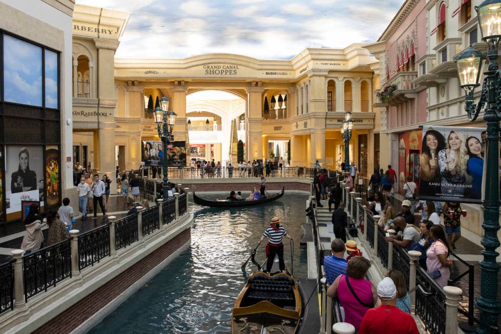 Tourists take a gondola ride in the Grand Canal at the Venetian hotel-casino photographed, on T ...