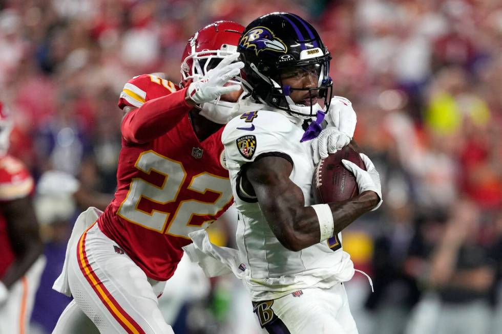 Baltimore Ravens wide receiver Zay Flowers (4) catches a pass against Kansas City Chiefs corner ...