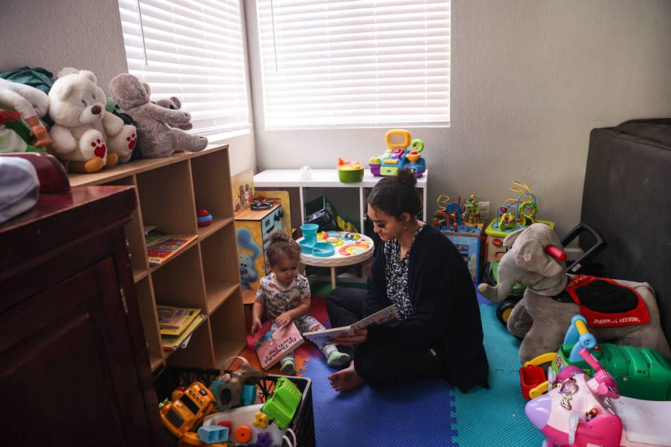 Katherine Sheffey plays with her son Kyo Sheffey, 2, at one of the properties owned by the nonp ...