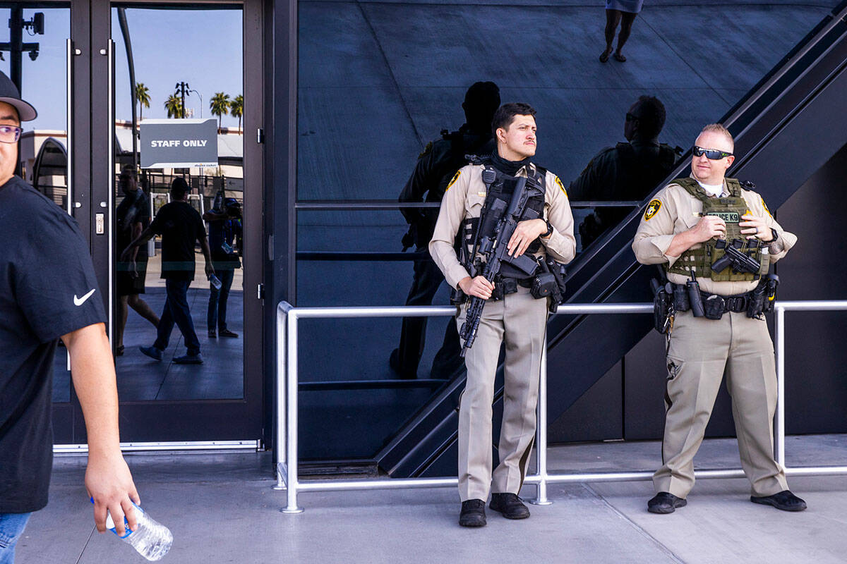 Metro Police stand at an entrance before the Raiders face the Miami Dolphins for their NFL game ...