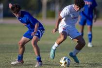 Bishop Gorman midfielder Rockwell Rabago (8) looks on as Coronado striker Dylan Flores (9) stea ...