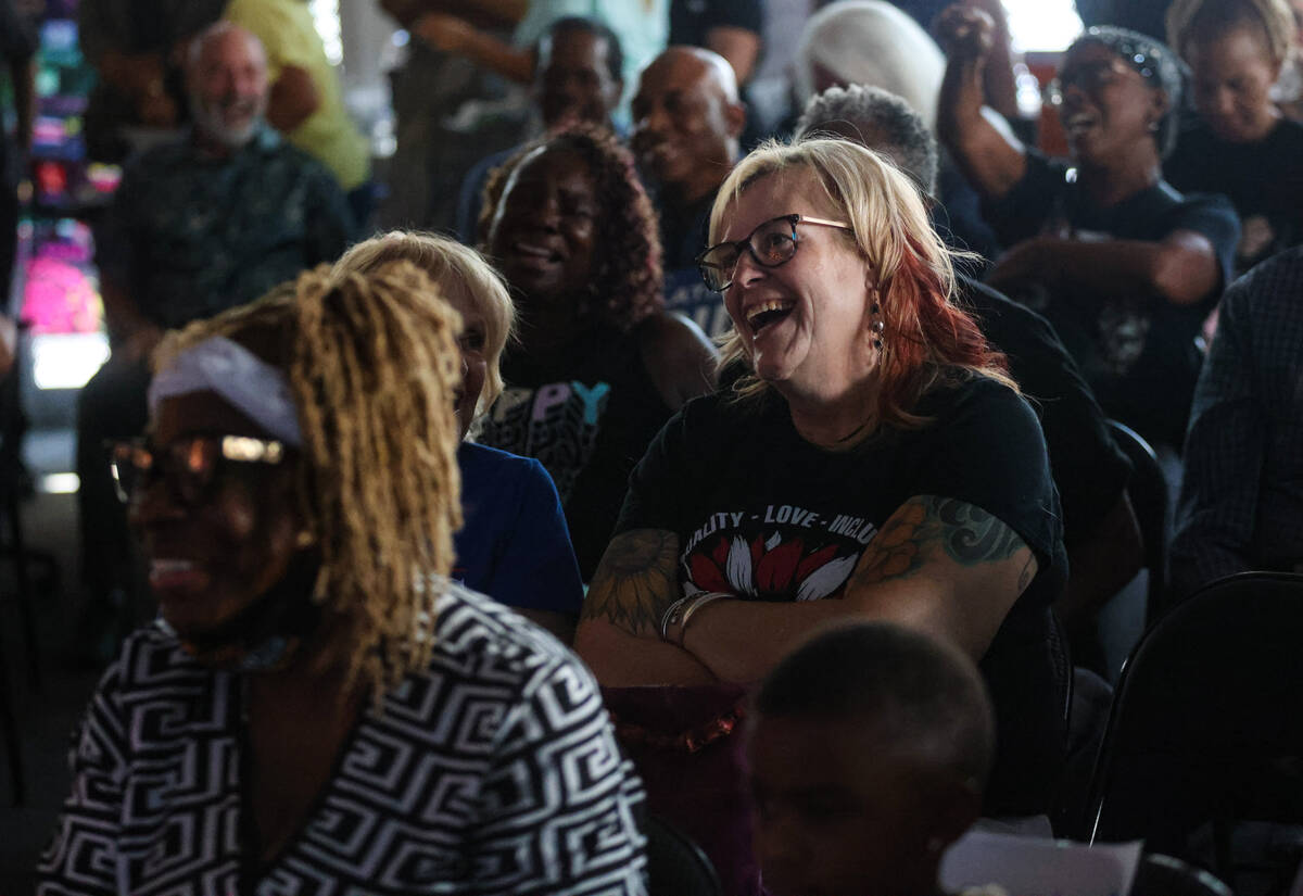 Attendees react during a watch party of the presidential debate between Kamala Harris and Donal ...