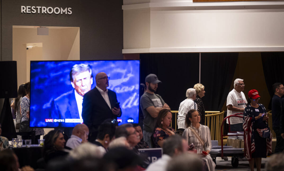 Supporters of Republican presidential nominee former President Donald Trump make their way out ...