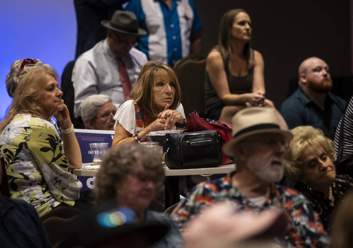 Supporters of Republican presidential nominee former President Donald Trump look on during a te ...