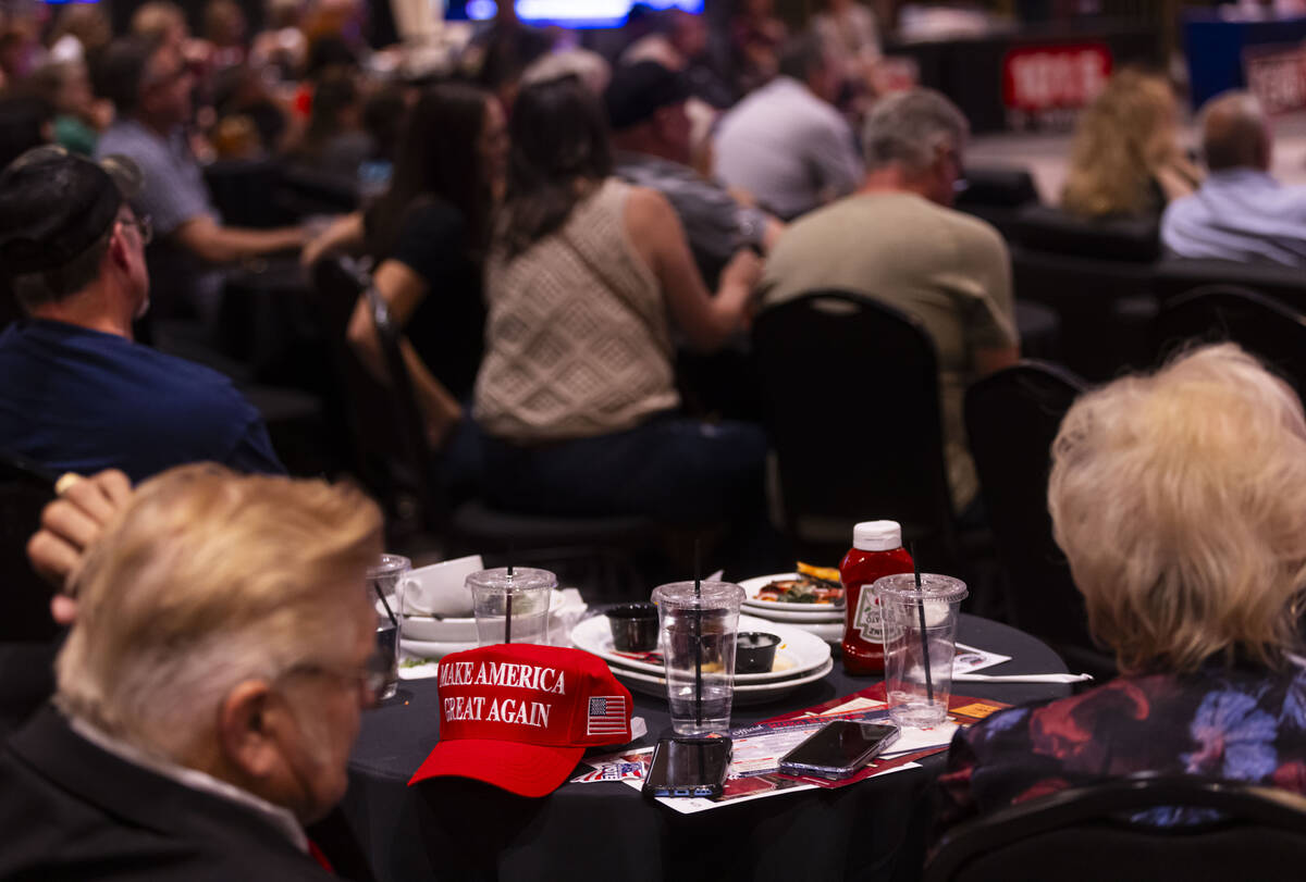 Supporters of Republican presidential nominee former President Donald Trump watch a televised d ...