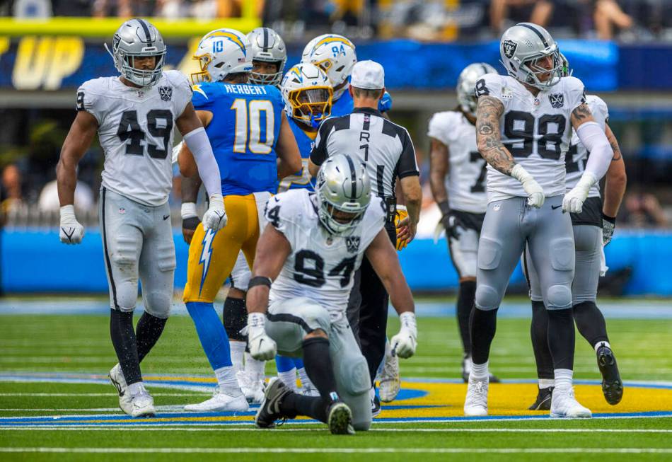 Raiders defensive tackle Christian Wilkins (94), defensive end Maxx Crosby (98) and defensive e ...