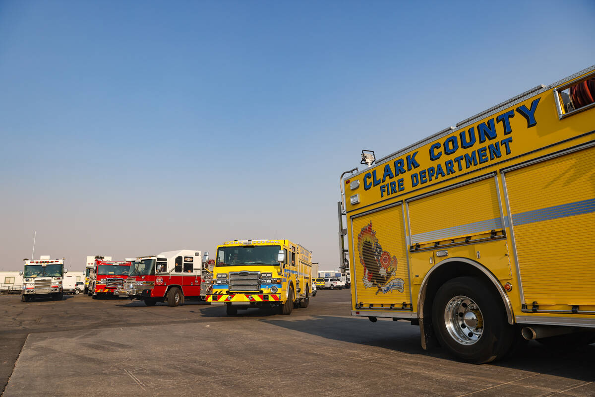 Firefighters depart to the Davis Fire from the Clark County Fire Department training center in ...