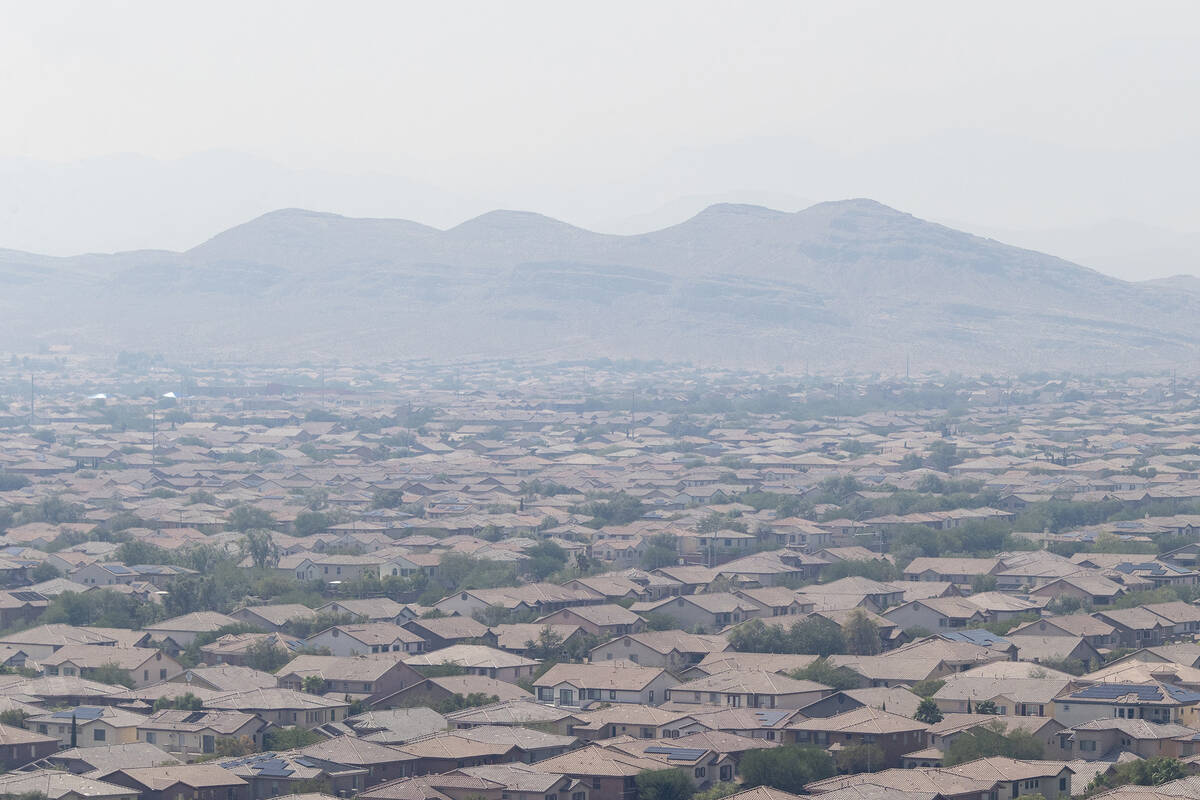 Strong winds blow in smoke from wildfires across the west coast, shrouding the city in a haze, ...