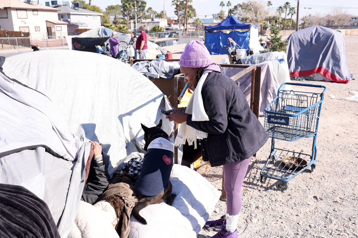 Dr. Catrina Grigsby-Thedford with the the Nevada Homeless Alliance, surveys a person sleeping o ...