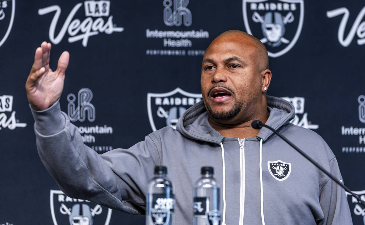 Raiders head coach Antonio Pierce answers a question during a media interview before practice a ...