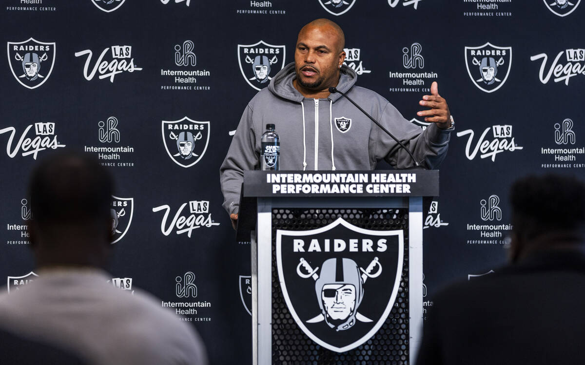 Raiders head coach Antonio Pierce answers a question during a media interview before practice a ...