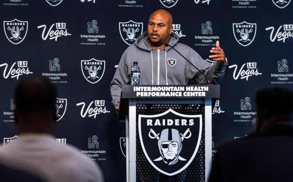 Raiders head coach Antonio Pierce answers a question during a media interview before practice a ...