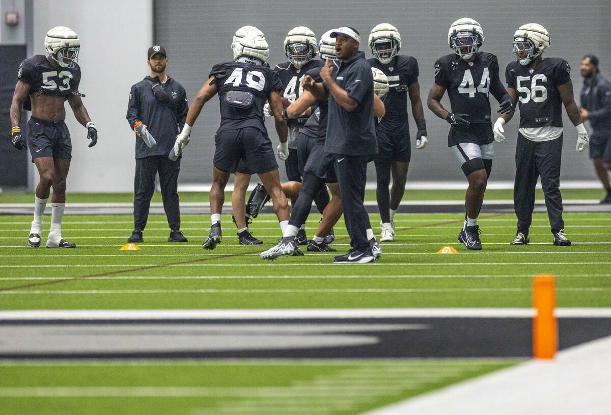 Raiders linebacker K'Lavon Chaisson (44) joins teammates in a drill during practice at the Inte ...