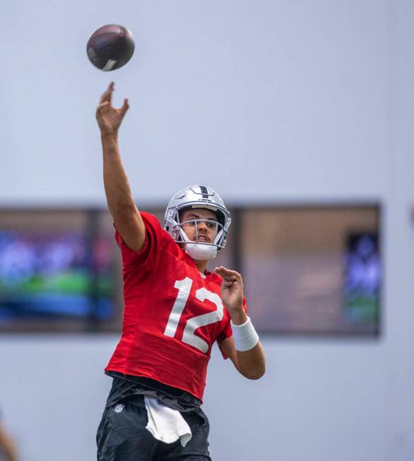 Raiders quarterback Aidan O'Connell (12) throws a pass during practice at the Intermountain Hea ...