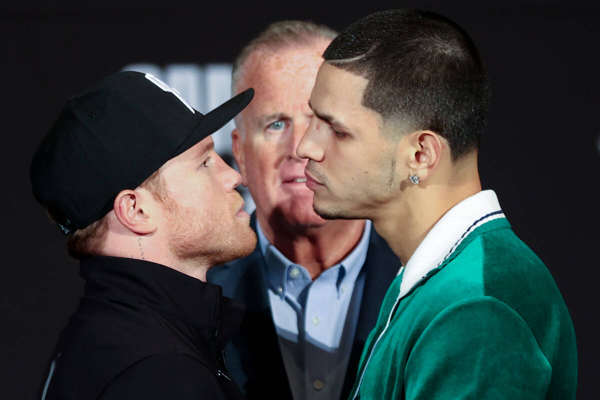 Canelo Alvarez, left, and Edgar Berlanga face off during a press conference ahead of their supe ...