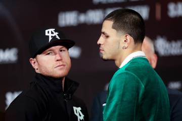 Canelo Alvarez, left, turns away after facing off with Edgar Berlanga during press conference a ...