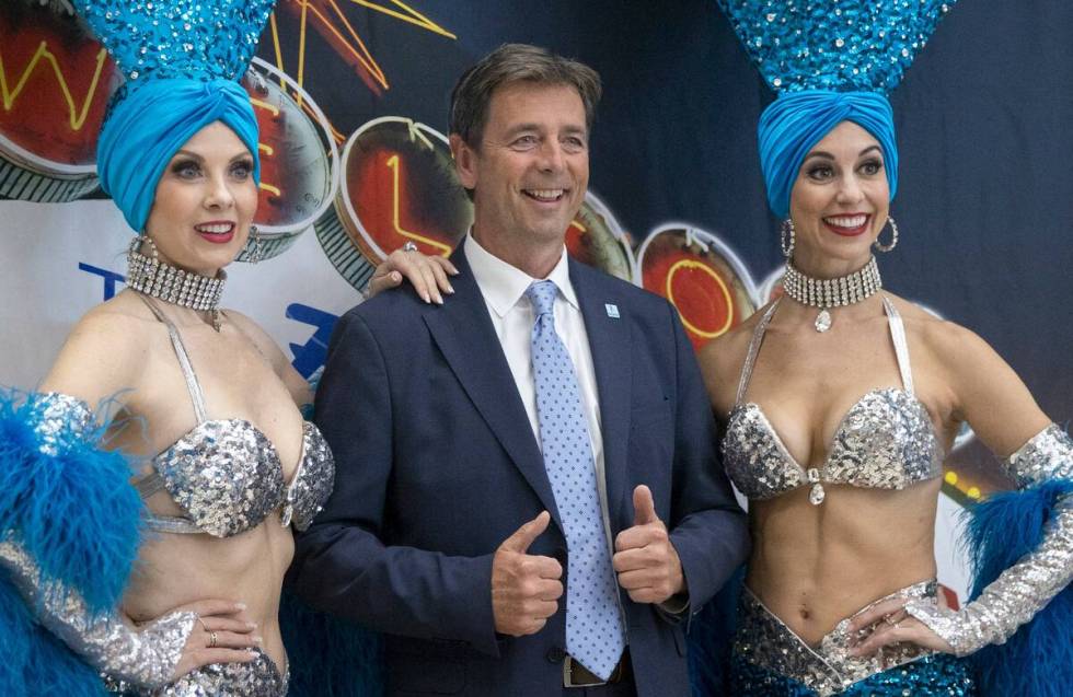 Founder and CEO of Norse Atlantic Airways Bjorn Tore Larsen poses with showgirls during the cel ...