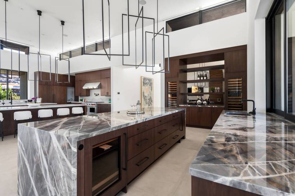 The kitchen features a large island. (Luxury Homes of Las Vegas)