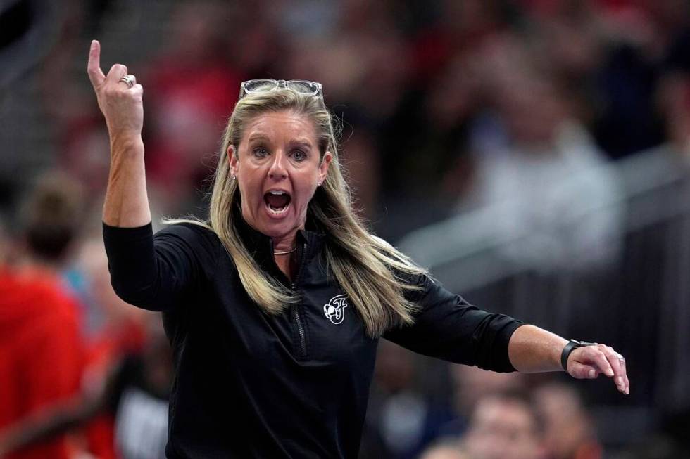 Indiana Fever head coach Christie Sides questions a call during the second half of a WNBA baske ...