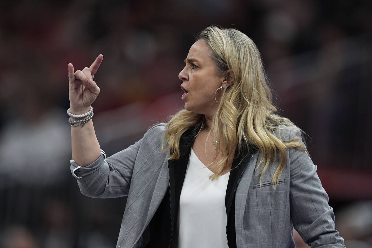 Las Vegas Aces head coach Becky Hammon calls a play during the second half of a WNBA basketball ...